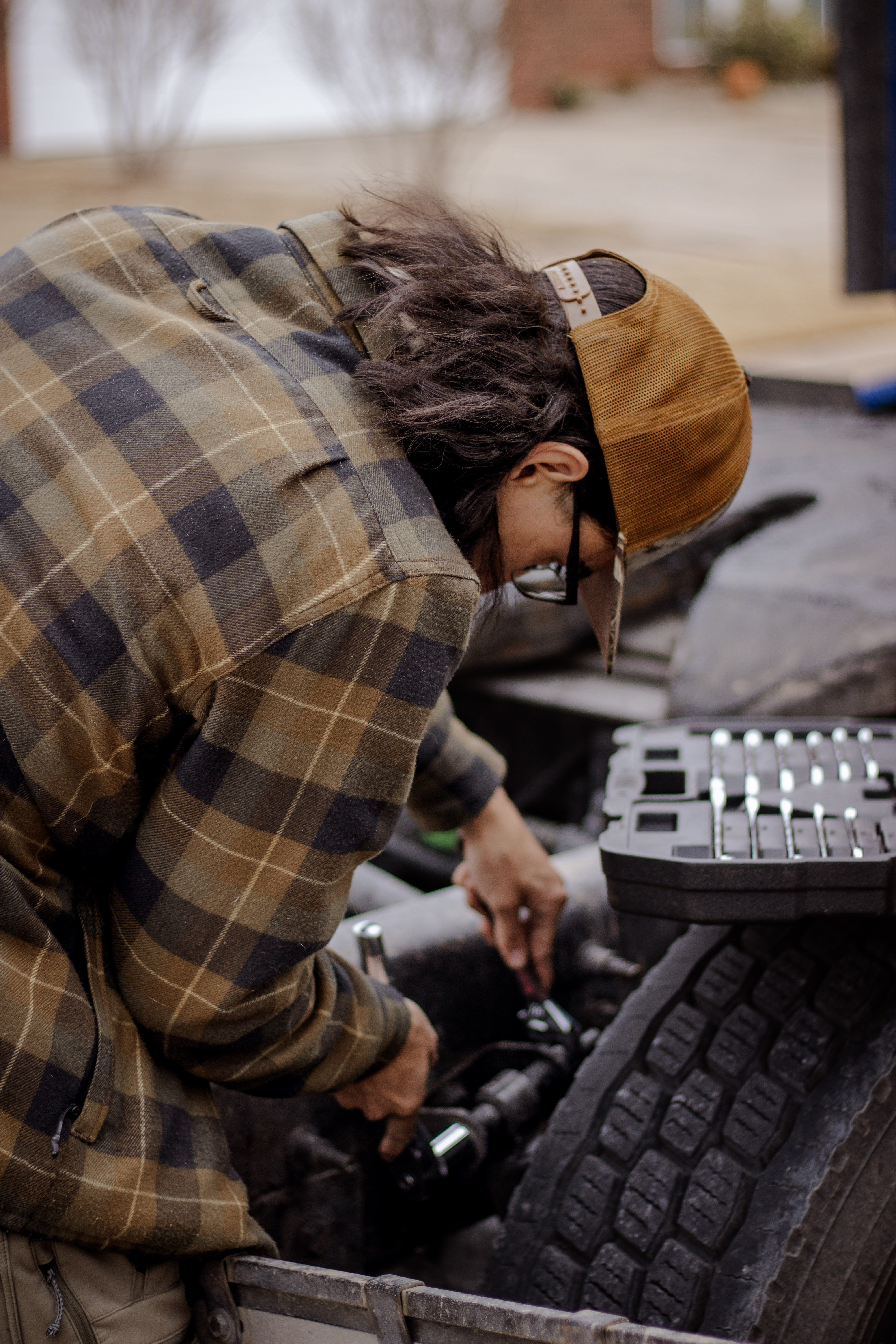 Driver checking truck equipment